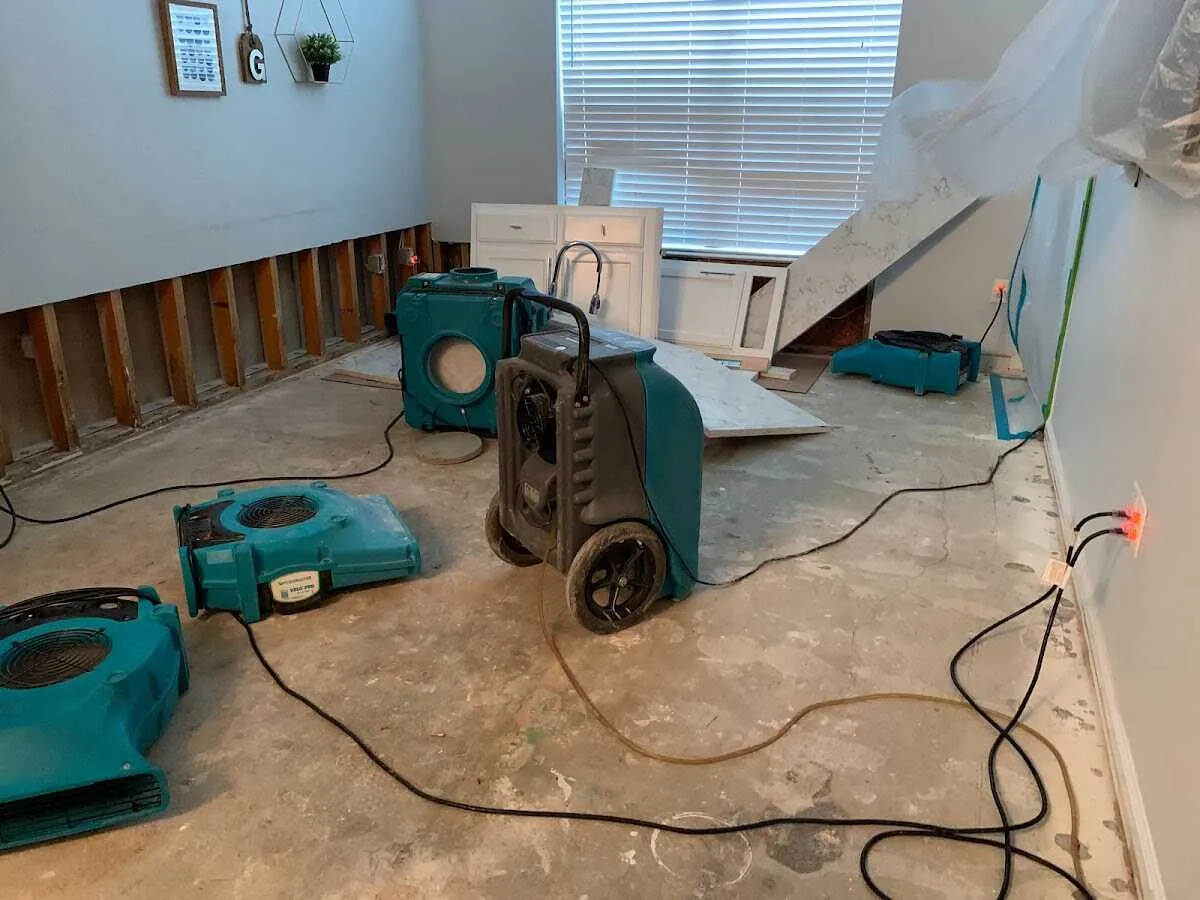 Dehumidifier in flood-cut room for Water Damage Restoration in Olive